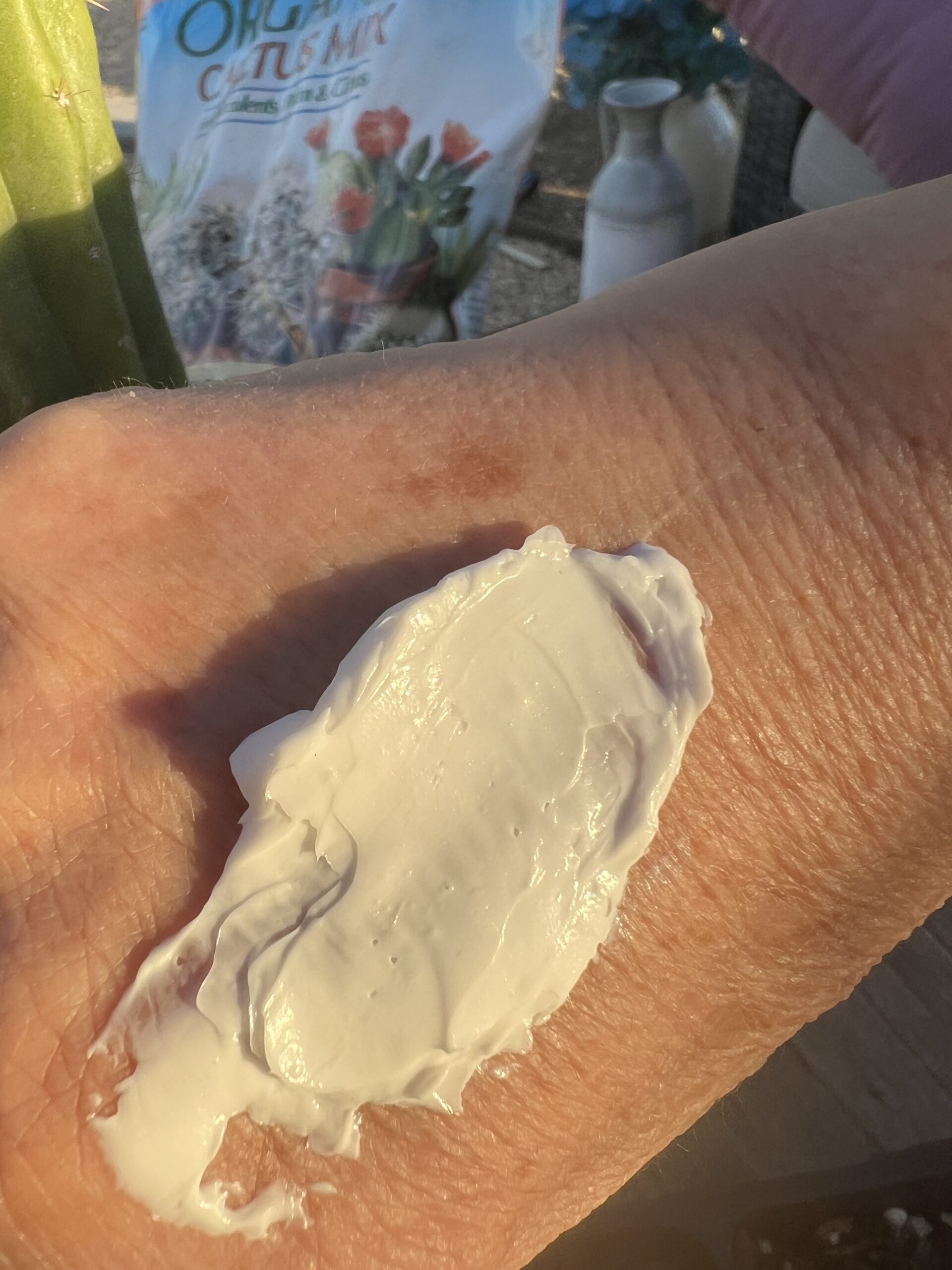 Woman with cream on her hand