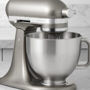 KitchenAid Artisan Plus stand mixer on a marble kitchen counter