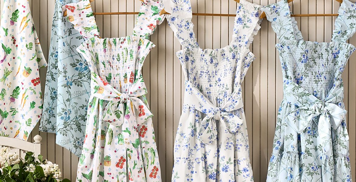 Hill House x Williams Sonoma aprons in three prints hanging on a wall