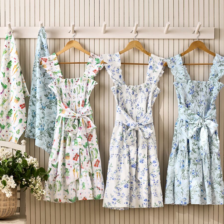 Hill House x Williams Sonoma aprons in three prints hanging on a wall