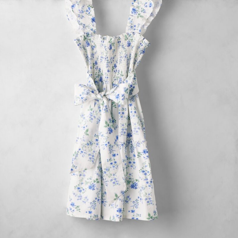 Hill House x Williams Sonoma Dewdrop Bouquet apron with blue floral print and ruffled shoulders