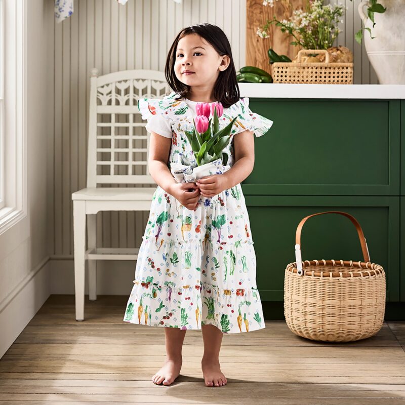 Child wearing the Hill House x Williams Sonoma Farmer's Market kids apron