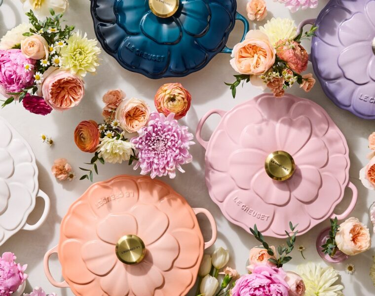 Le Creuset Petal Braisers in pastel colors surrounded by flowers