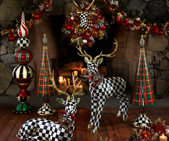 MacKenzie-Childs holiday decor with black-and-white checkered reindeer, plaid trees, bows and Christmas garland
