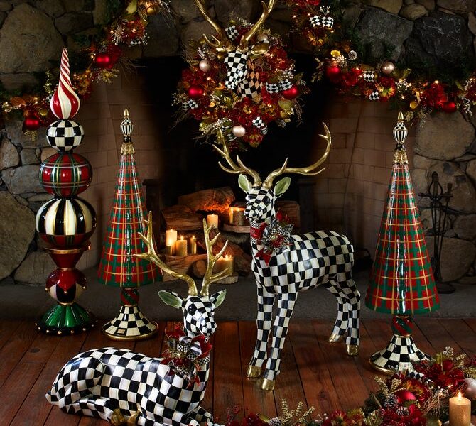 MacKenzie-Childs holiday decor with black-and-white checkered reindeer, plaid trees, bows and Christmas garland