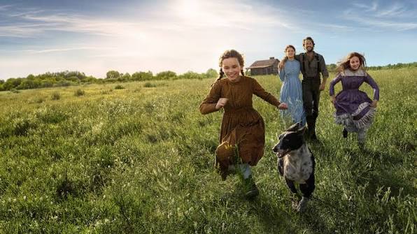 The Ingalls family running through a field in Netflix's Little House on the Prairie reboot (2026)