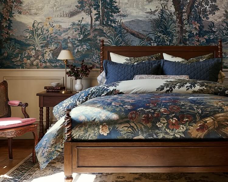 Pottery Barn Kravet Folly Collection bedroom with scenic botanical bedding and wallpaper